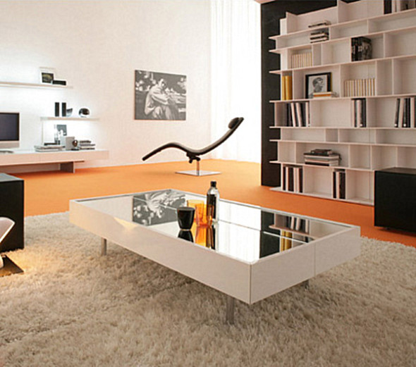 Textured edges and tapered legs give mirrored coffee table an antique look.