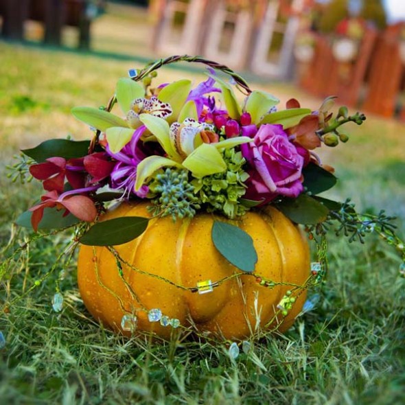 a flower- filled faux pumpkin is an adorable addition to decor