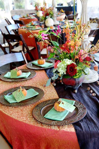 Mini pumpkins can double as place card holders for guests