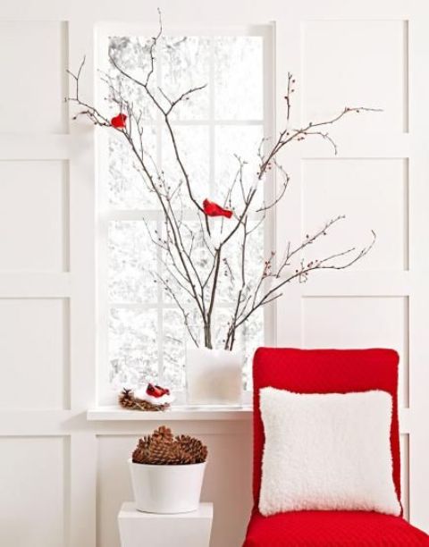 fir branches in transparent vase filled with cotton