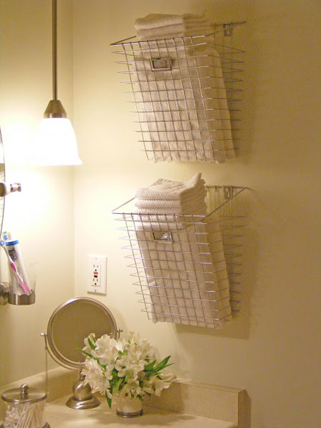 Displaying  towels in sleek chrome baskets will add on to overall theme. 