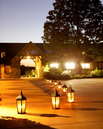 Illuminate the walkway to the reception with antique lanterns or you can use tea lights along the line to aisle and create a  romantic and classy ambiance 