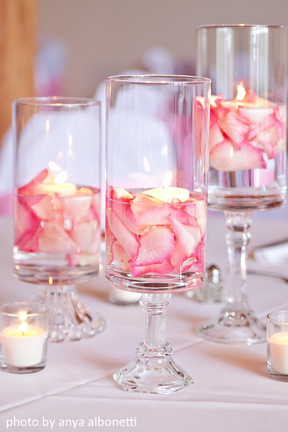 Rose petals with votive in a sleek and elegant vase, it gives the desired elegance and gorgeous touch to the table