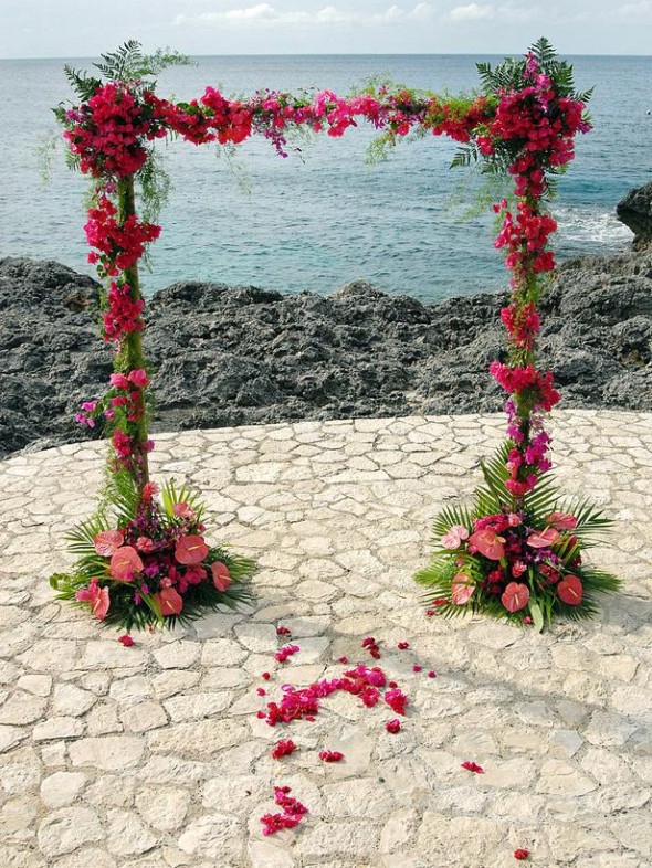 opt to decorate the wedding arches with seasonal flowers like daisies, hydrangea, and roses.