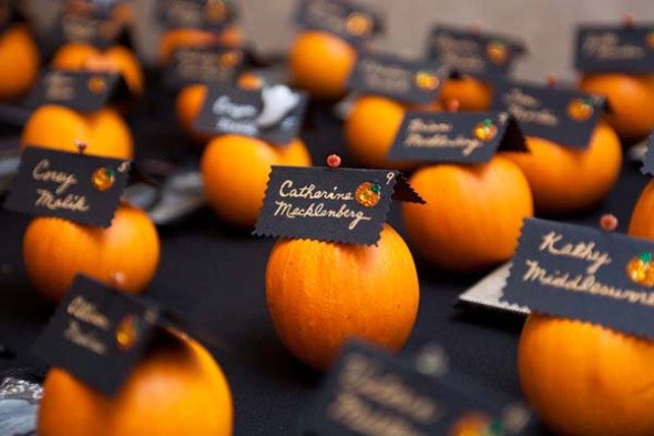 Attach escort cards to mini pumpkins, they add a flair to the overall theme.
