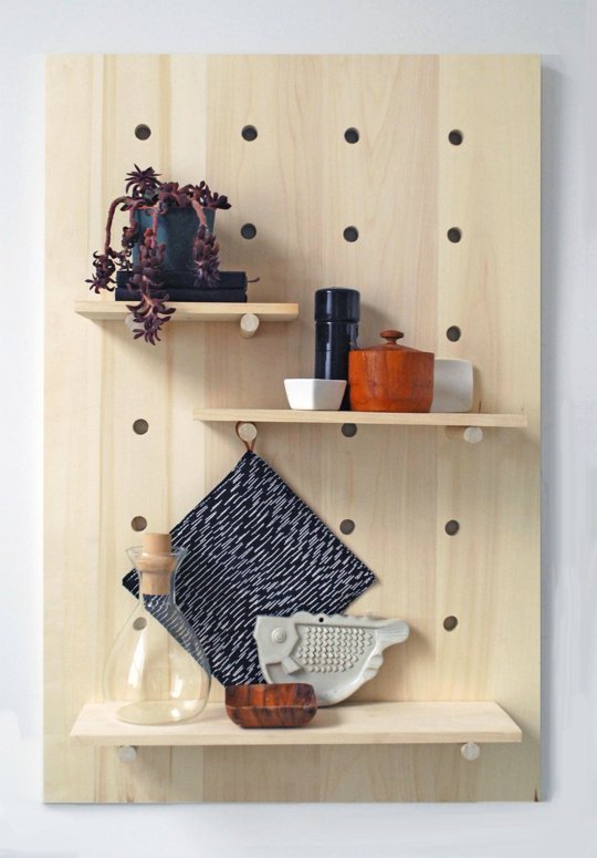 Pegboard racks can get your belongings organized while keeping them from taking up your limited floor or counter space.